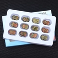 Set of 12 hand-carved gemstone pig figurines in ruby zoisite with red and green textures - Unakite