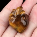 Polished golden brown Tiger's Eye gemstone heart with natural striped texture - Tiger's Eye