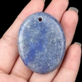 Polished blue lapis lazuli oval palm stone pendant with natural mineral textures - Blue Aventurine