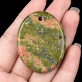 Polished unakite oval palm stone pendant with pre-drilled hole and natural green orange texture - Unakite
