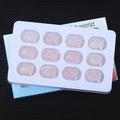 Set of 12 hand-carved pink rose quartz wolf figurines in a white display tray - Rose Quartz