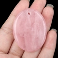 Handheld oval pink crystal palm stone pendant with polished natural rose quartz texture - Rose Quartz