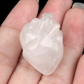 Mini anatomical crystal heart carving in translucent white natural stone held in hand - Clear Quartz (1pc)