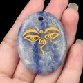 Engraved Lapis Lazuli palm stone pendant featuring a golden All Seeing Eye on blue natural stone - Blue Aventurine