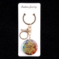 Colorful resin gemstone keychain with gold flower pattern and Om symbol charm - Six-petal Flower Om Style (No. 45)