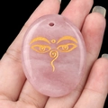 Oval rose quartz pendant featuring a golden Buddha Wisdom Eyes symbol for meditation - Rose Quartz