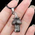 Spotted natural stone mushroom pendant with metal witch hat on a black cord necklace - Larvikite