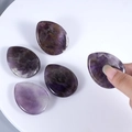 Set of five polished teardrop-shaped natural amethyst worry stones for healing - Amethyst