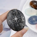 Engraved labradorite palm stone with silver compass rose design for meditation - Larvikite