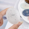Polished white quartz palm stone with engraved compass star design and N-S-E-W markers - White Crystal