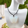 Carved opal butterfly pendant necklace with black woven rope and blue fire flash - Synthetic Opal Style