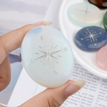Polished opal healing palm stone with engraved compass design for meditation - Opal (Synthetic)