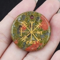 Handheld Unakite gemstone pendant featuring an engraved golden Viking Vegvisir symbol - Unakite