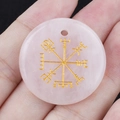 Pink quartz Viking compass round pendant being held to show 30mm size and details - Rose Quartz