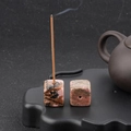 Square pink rhodonite crystal incense holder with natural stone texture and single hole - Rhodonite