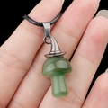 Green crystal mushroom pendant with silver witch hat on a black woven cord necklace - Green Aventurine
