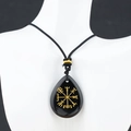 Vintage Viking Vegvisir necklace featuring a black teardrop stone with gold engraving - Obsidian