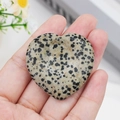 Handheld heart-shaped Dalmatian Jasper worry stone with natural black spotted pattern - Dalmatian Jasper