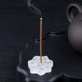 White crystal lotus incense holder with stick shown on a zen black tray setup - White Crystal