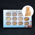 Set of 12 hand-carved gemstone cat figurines in a white display box with diverse minerals - Yellow Jade