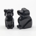 Hand-carved obsidian puppy dog stone figurine with a polished black finish for decor - Obsidian