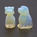 Mini carved dog figurines crafted from translucent opalite gemstone with a blue glow - Opal (Synthetic)