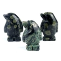 Three mini penguin figurines carved from natural green spotted jasper stone - Rhyolite