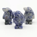 Three hand-carved blue sodalite penguin figurines with natural white mineral patterns - Blue Sodalite