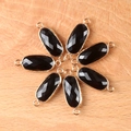 Oval black agate stone connector with faceted surface and gold plated double loops - Obsidian
