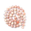 Faceted natural pink stone beads in wheel shape with small golden spacers for DIY jewelry - Sunstone