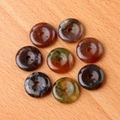 Polished agate stone donut pendants in various natural colors on a light wood background - Indian Agate (1pc)