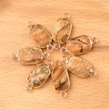 Set of seven rectangular marble stone connectors with gold plated dual hole frames - Picture Stone