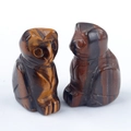 Hand-carved owl figurines made of natural tiger eye stone with golden brown textures - Tiger's Eye