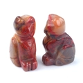 Hand-carved Red Jasper owl figurines with natural mottled stone textures - Colored Jade