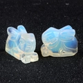 Pair of carved opalite rabbit figurines with translucent milky white and blue tones - Opal