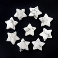 Polished white howlite star shaped stones with natural grey marble textures - Howlite