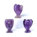 Three purple amethyst mini angel figurines with polished finish on white steps - Amethyst