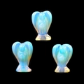 Three-piece opalite crystal angel set with iridescent blue and orange glow highlights - Synthetic Opal