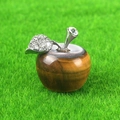 Mini tiger eye stone apple figurine with silver leaf detail on green lawn - Tiger's Eye