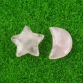 Natural rose quartz star and moon stones on a green background for decoration - Rose Quartz