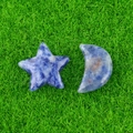 Blue sodalite stone star and moon decorative set on green lawn background - Sodalite