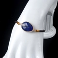 Adjustable faceted lapis lazuli bracelet with gold-plated edge and brown braided cord - Lapis Lazuli