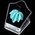 Green turquoise maple leaf pendant with black vein pattern on brown braided cord - Blue Turquoise
