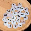 Polished opalite runes set with gold etched Norse symbols on a rustic wooden tray - Opal (Synthetic)