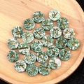 Green aventurine crystal rune stone set with gold engraved symbols in a wooden tray - Qinghai Jade
