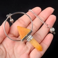 Polished silver ring with orange hexagonal crystal pendulum on a metallic chain - Topaz