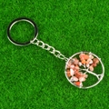 Tree of Life keychain with orange-pink crystal stones and woven silver wire - Red Agate