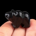 Polished black agate polar bear crystal stone carving animal figurine held in hand - Obsidian
