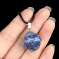 Blue and white natural crystal planet pendant with Saturn ring on black cord - Planet Shape (1926) / Sodalite