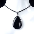 Silver teardrop necklace featuring a polished black onyx pendant on a simple black cord - Obsidian (Silver Edging)